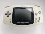 Nintendo Game Boy Advance AGB-001 Handheld System White/gray W/ Headphone Jack. Fixed Price $56.99.