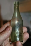 Antique 4 1/2'' Green, Push-up, Sample Size, Wine Bottle, Item # 2817. Fixed Price $34.99.