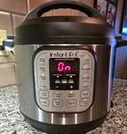 Instant Pot IP-DUO60 Qt. 7-IN1 Electric Pressure Cooker Black/silver. Fixed Price $79.00.